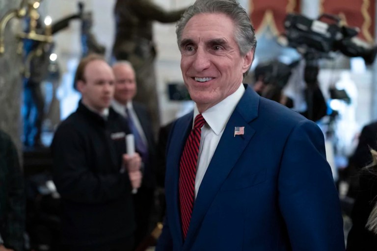 Secretary of the Interior Doug Burgum walks to the House Chamber before of President Donald Trump addresses a joint session of Congress at the Capitol in Washington, Tuesday, March 4, 2025.