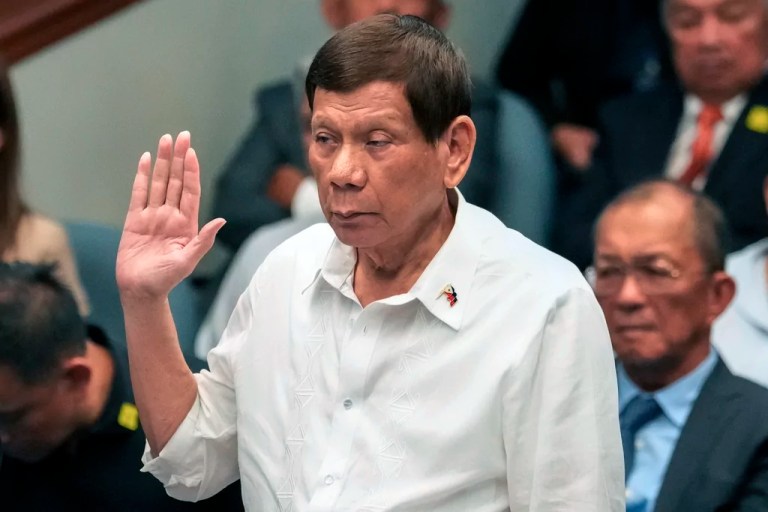 Former Filipino President Rodrigo Duterte takes an oath during a senate inquiry on the so-called war on drugs during his administration at the Philippine Senate, Oct. 28, 2024, in Manila, Philippines.