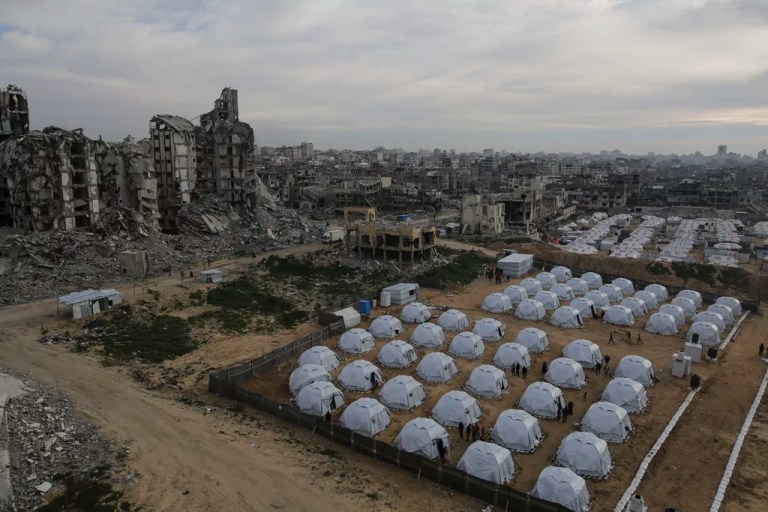 A tent camp for displaced Palestinians is set up among destroyed buildings in the west of Al-Shati camp, west of Gaza City, on Monday, March 3, 2025.