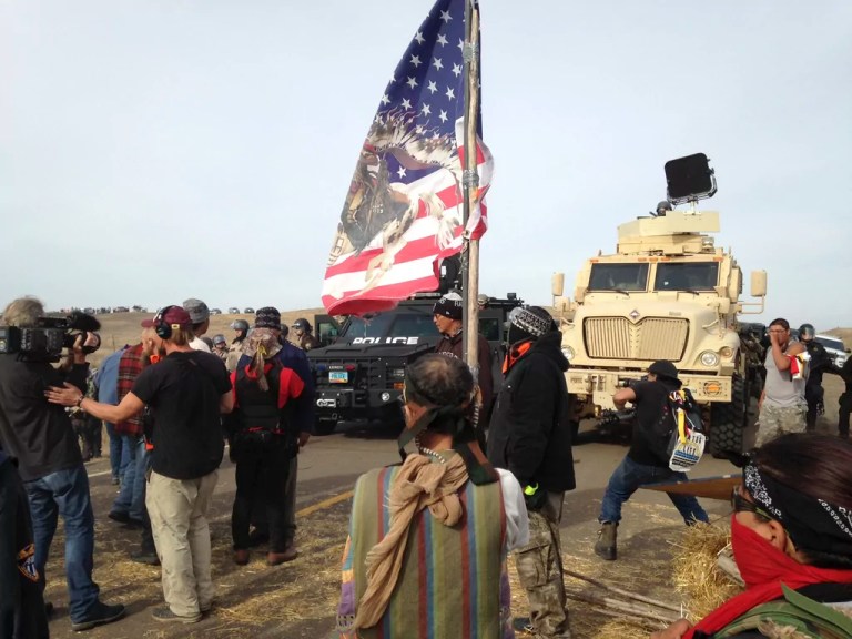 Dakota Access pipeline protesters defy law enforcement officers who are trying to force them from a camp on private land in the path of pipeline construction, Oct. 27, 2016, near Cannon Ball, N.D.