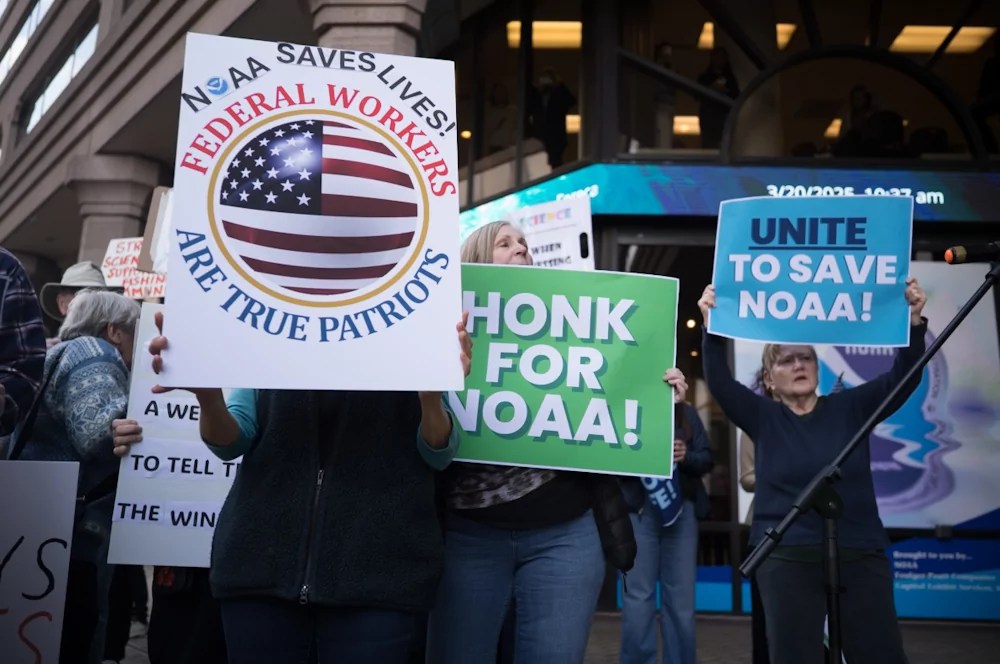 A protest in support of federal workers outside the National Oceanic and Atmospheric Administration in Silver Spring, Maryland on Thursday, March 21, 2025. The federal workforce has been cut through efforts backed by Elon Musk's Department of Government Efficiency. (Graeme Jennings/Washington Examiner)
