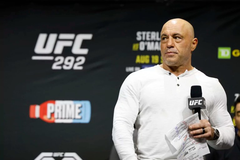Joe Rogan is seen at the ceremonial weigh-in for the UFC 292 mixed martial arts event, Friday, August 18, 2023, in Boston. (AP Photo/Gregory Payan)