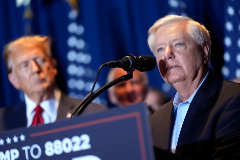 Sen. Lindsey Graham, R-S.C., speaks as Republican presidential candidate former President Donald Trump listens at a primary election night party in Columbia, S.C., Feb. 24, 2024.