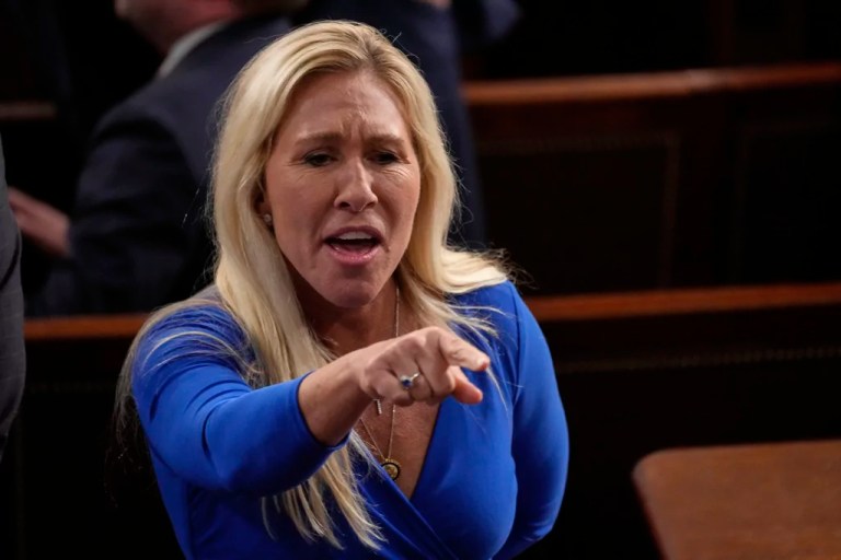 Rep. Marjorie Taylor Greene, R-Ga., talks before President Donald Trump addresses a joint session of Congress in the House chamber at the U.S. Capitol in Washington, Tuesday, March 4, 2025. (AP Photo/Julia Demaree Nikhinson)