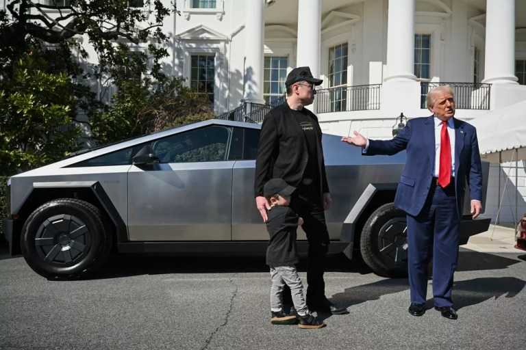 President Donald Trump and Tesla CEO Elon Musk, along with his son X Æ A-Xii, speak to reporters by a Tesla vehicle on the South Lawn of the White House Tuesday, March 11, 2025, in Washington.