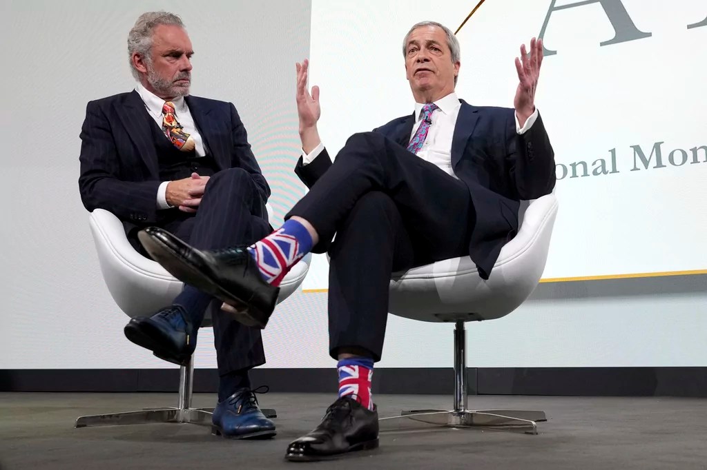 Nigel Farage, Leader of Reform UK, right, as he is interviewed on stage by Jordan Peterson, left, at the ARC (Alliance for Responsible Citizenship) conference in London, Tuesday, Feb. 18, 2025.