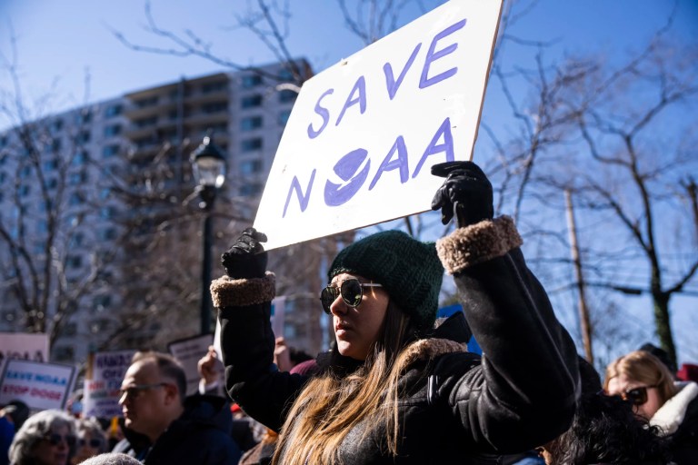 Demonstrators attend rally outside the National Oceanic and Atmospheric Administration headquarters to oppose the recent NOAA layoffs, in Sliver Spring, Md., on Monday, March 3, 2025. Sen. Chris Van Hollen, D-Md., and other members of Congress also attended. (Tom Williams/CQ Roll Call via AP Images)