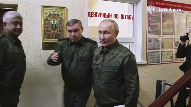 In this image made from video released by the Russian Presidential Press Service, on Wednesday, March 12, 2025, Russian President Vladimir Putin, right, accompanied by Russian Chief of General Staff Gen. Valery Gerasimov, second left, visits military headquarters in the Kursk region of Russia.