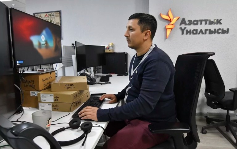 A journalist works in a newsroom of Radio Free Europe/Radio Liberty's local branch, called Radio Azattyk, in Bishkek, Kyrgyzstan, on Friday, April 28, 2023.