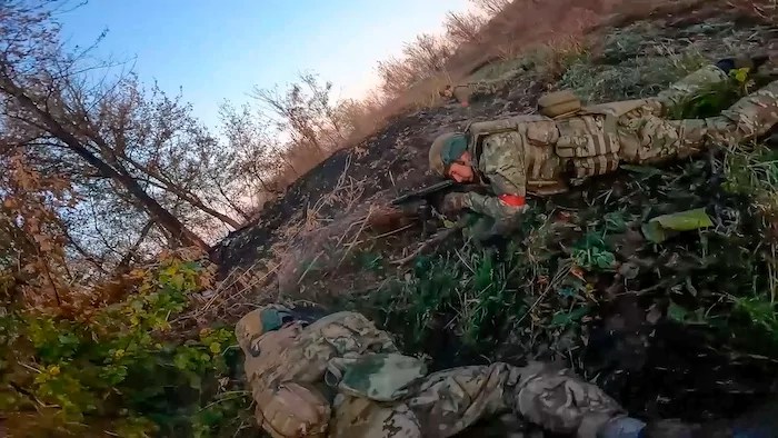 In this image from video released by the Russian Defense Ministry on Nov. 7, 2024, Russian Army soldiers fight with Ukrainian Armed forces in the Sudzhansky district of the Kursk region of Russia.