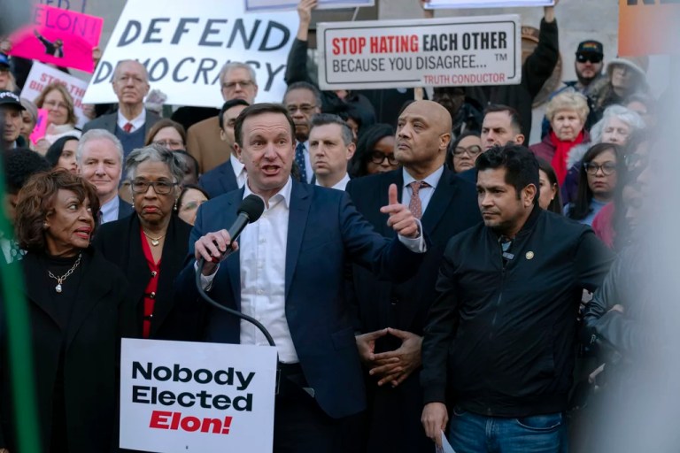 Sen. Chris Murphy (D-CT) accompanied by other members of Congress, speaks during a rally against Elon Musk outside the Treasury Department in Washington, Tuesday, Feb. 4, 2025.