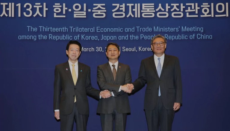 South Korean Industry Minister Ahn Duk-geun, center, Japanese Trade Minister Yoji Muto, and Chinese Commerce Minister Wang Wentao, right, pose during the 13th Trilateral Economic and Trade Ministers' Meeting to discuss economic cooperation in Seoul, South Korea, Sunday, March 30, 2025.