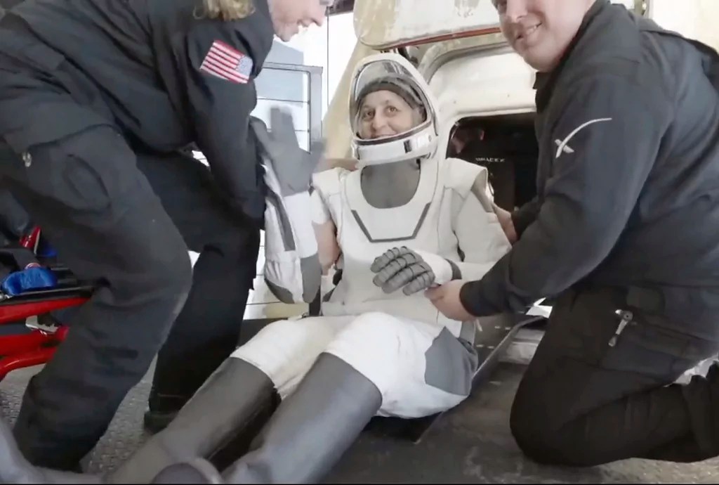 This image taken from video provided by SpaceX shows NASA's Suni Williams being helped after exiting the SpaceX capsule, Tuesday, March 18, 2025.