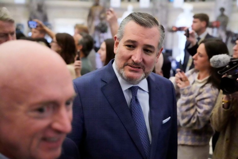 Sen. Mark Kelly (D-AZ) left, and Sen. Ted Cruz (R-TX) arrive before President Donald Trump addresses a joint session of Congress at the Capitol in Washington, Tuesday, March 4, 2025.