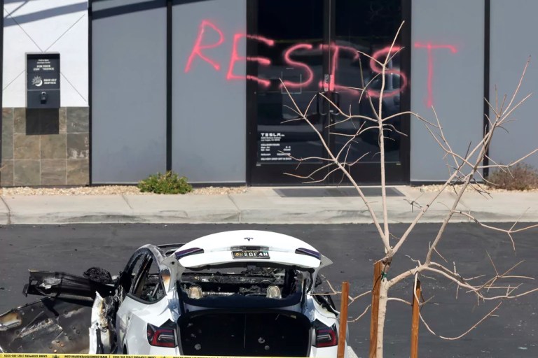 A burned Tesla vehicle is shown at a Tesla collision center, Tuesday, March 18, 2025, in Las Vegas.