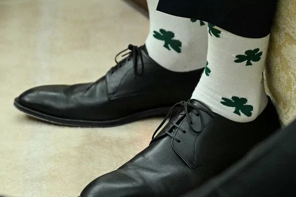 US Vice President JD Vance wears socks with shamrocks during a meeting with US President Donald Trump and Irish Prime Minister Micheal Martin in the Oval Office of the White House in Washington, DC, on March 12, 2025.