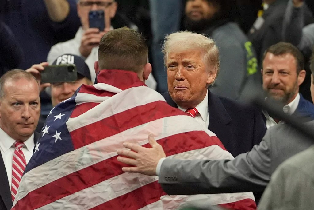 President Donald Trump, greets Oklahoma State's Wyatt Hendrickson