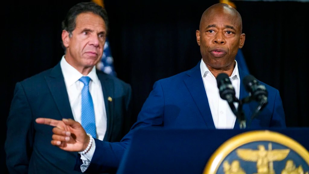 Brooklyn Borough President and New York City mayoral candidate Eric Adams, right, speaks to the media accompanied by Gov. Andrew Cuomo during a news conference at Lenox Road Baptist Church in the Brooklyn borough of New York on Wednesday, July 14, 2021. (AP Photo/Eduardo Munoz Alvarez)