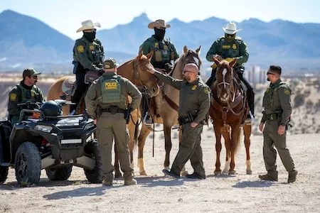 Border Patrol agents wait for the arrival of Defense Secretary Pete Hegseth for a visit to the US-Mexico border in Sunland Park, N.M., Monday, Feb. 3, 2025. (AP Photo/Andres Leighton)