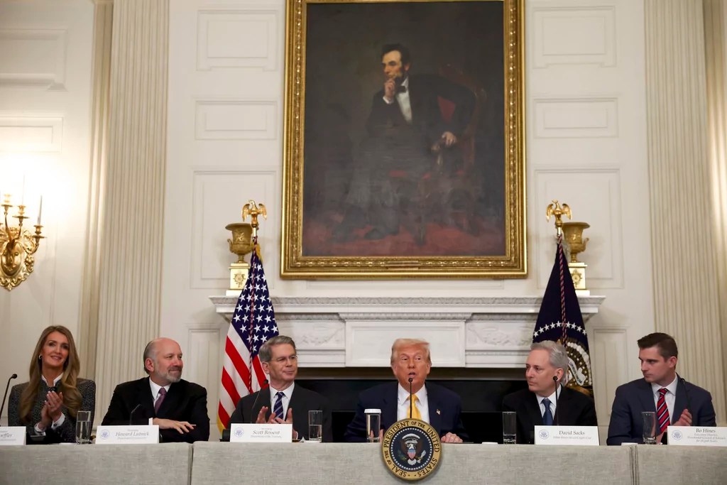 President Donald Trump speaks as administrator Kelly Loeffler, of the Small Business Administration, from left, Secretary of Commerce Howard Lutnick, Treasury Secretary Scott Bessent, White House AI and crypto czar David Sacks and Bo Hines, a member of the presidential council of advisers for digital assets, listen at the White House Crypto Summit in Washington, Friday, March 7, 2025.