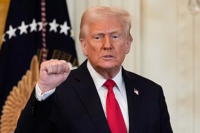 President Donald Trump gestures after speaking at a reception celebrating Women's History Month in the East Room of the White House, Wednesday, March 26, 2025, in Washington. (AP Photo/Mark Schiefelbein)