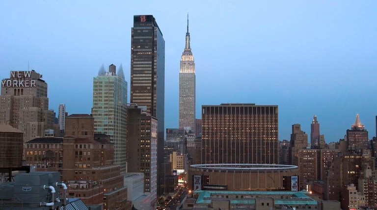 The New York skyline, including the Empire State Building, center, sits shortly after sunset in this view looking west Wednesday, April 6, 2005. Investigators have concluded that new thinking is needed on how to evacuate people from endangered skyscrapers and how to get rescuers into them more quickly, according to a federal report issued by engineers during a briefing Tuesday analyzing the collapse of the World Trade Center towers.