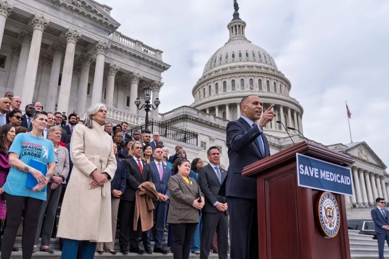 House Minority Leader Hakeem Jeffries (D-NY), right, joined at center left by Rep. Katherine Clark, (D-MA), the House minority whip, rallies Democrats against the Republican budget plan, on the House steps at the Capitol in Washington, Tuesday, Feb. 25, 2025.