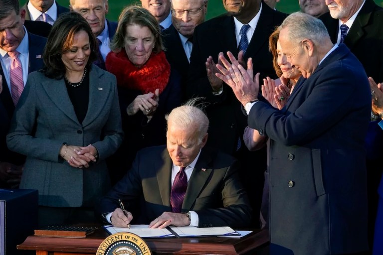Former President Joe Biden signs a $1.2 trillion bipartisan infrastructure bill into law during a ceremony on the South Lawn of the White House in Washington, Nov. 15, 2021. On Tuesday, Feb. 27, 2024, the Biden administration will announce 17 projects across the U.S. to expand renewable energy access in rural areas, particularly for Native American tribes. The projects, which will cost $366 million, are funded by the infrastructure law Biden signed in 2021.