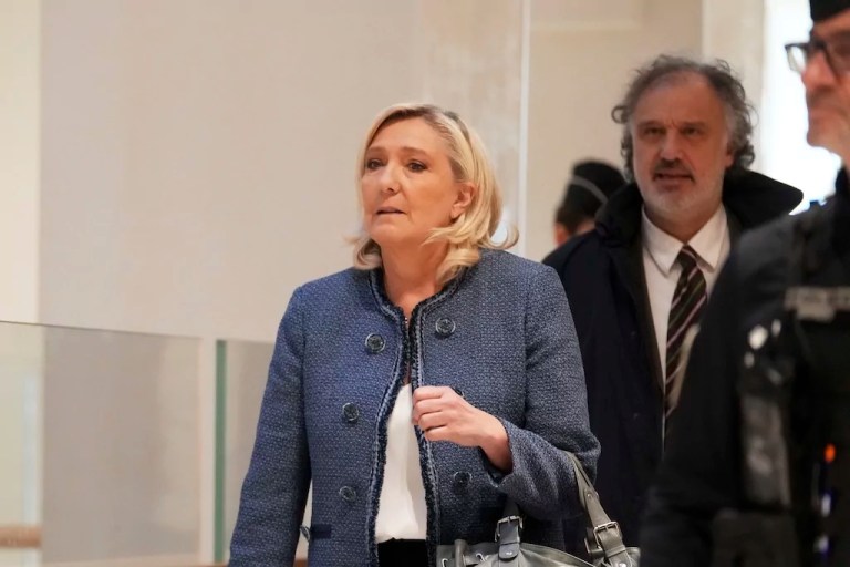 French right-wing leader Marine Le Pen arrives at a Paris court.