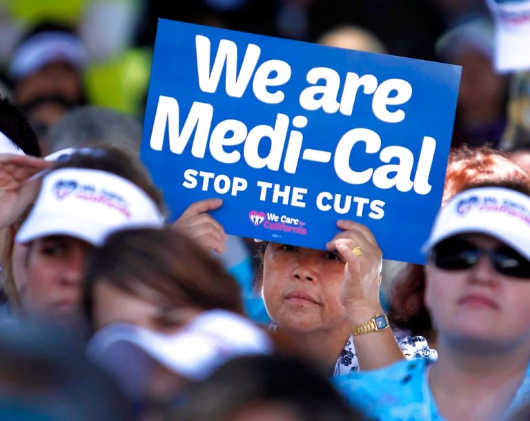 In this June 4, 2013, file photo, demonstrators representing doctors, hospitals, and unionized healthcare workers rally against cuts in the amount the state pays for Medi-Cal reimbursements at the Capitol in Sacramento, California.