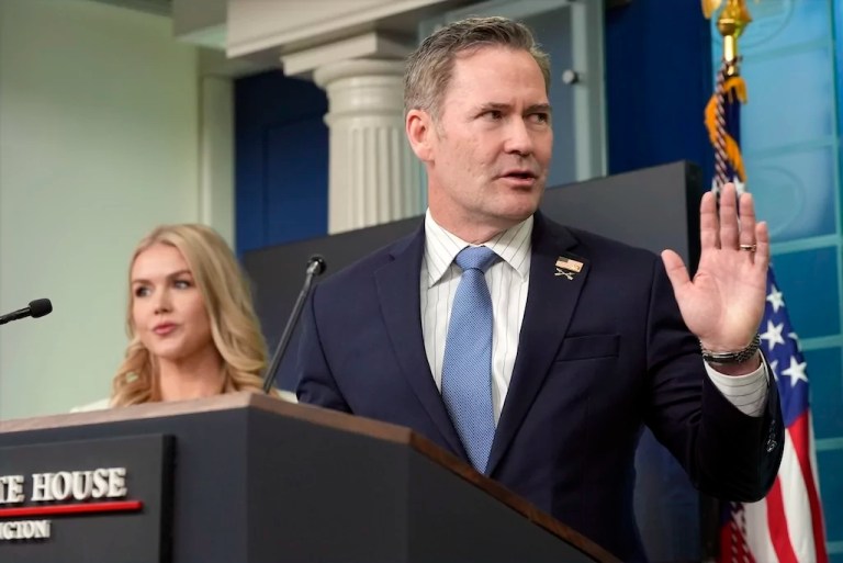 White House national security adviser Mike Waltz speaks with reporters in the James Brady Press Briefing Room at the White House, Thursday, Feb. 20, 2025, in Washington, as White House press secretary Karoline Leavitt listens.