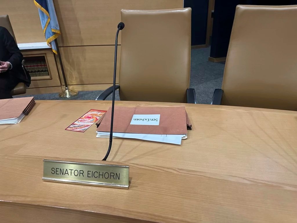 The chair for Minnesota state Sen. Justin Eichorn, a Republican from Grand Rapids, sits empty in a Senate hearing room in the State Capitol complex in St. Paul on Tuesday, March 18, 2025, a day after his arrest in Bloomington for allegedly soliciting a minor for prostitution.