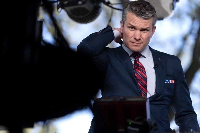 Defense Secretary Pete Hegseth prepares to give a television interview outside the White House, Friday, March 21, 2025, in Washington.