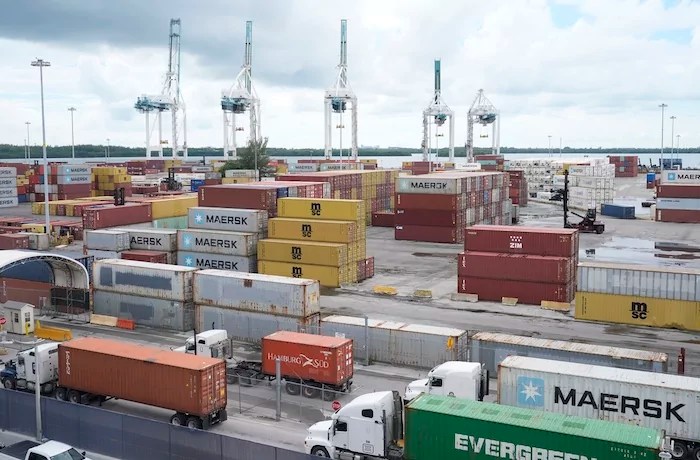 Dockworkers return to work at PortMiami after the union representing 45,000 striking U.S. dockworkers reached a deal to suspend a three-day strike, Friday, Oct. 4, 2024, in Miami.
