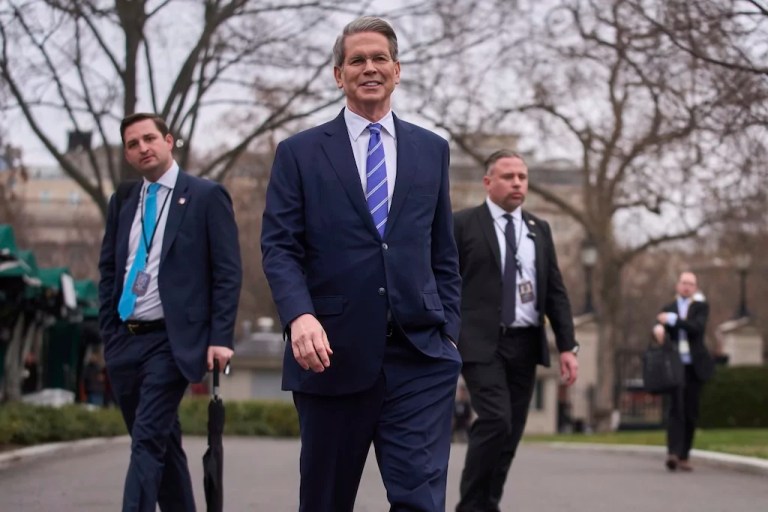 Treasury Secretary Scott Bessent walks to speak with reporters at the White House, Thursday, March 13, 2025, in Washington.