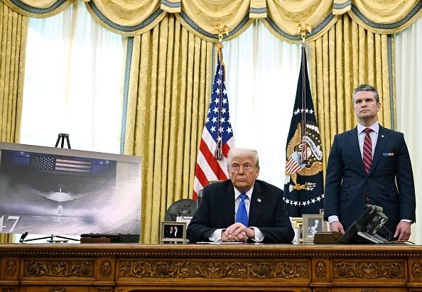 US President Donald Trump and Secretary of Defense Pete Hegseth listen during an event in the Oval Office of the White House in Washington, DC, on March 21, 2025. Trump announced the award to Boeing of a major contract for the Air Force's high-tech next-generation F-47 fighter plane.