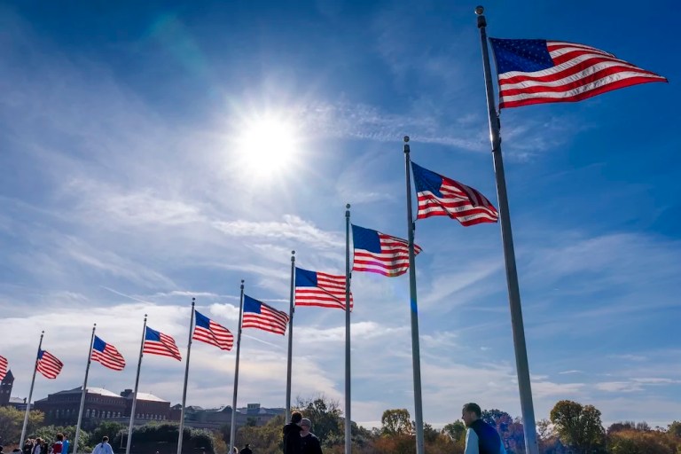American flags wave at the Washington Monument in Washington, Monday, Nov. 4, 2024.