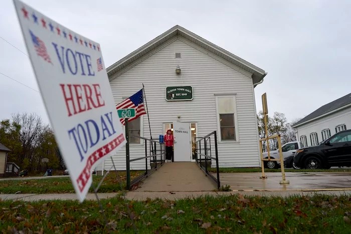 A voter leaves Albion Town Hall after casting their ballot on Election Day, Tuesday, Nov. 5, 2024, in Wisconsin.