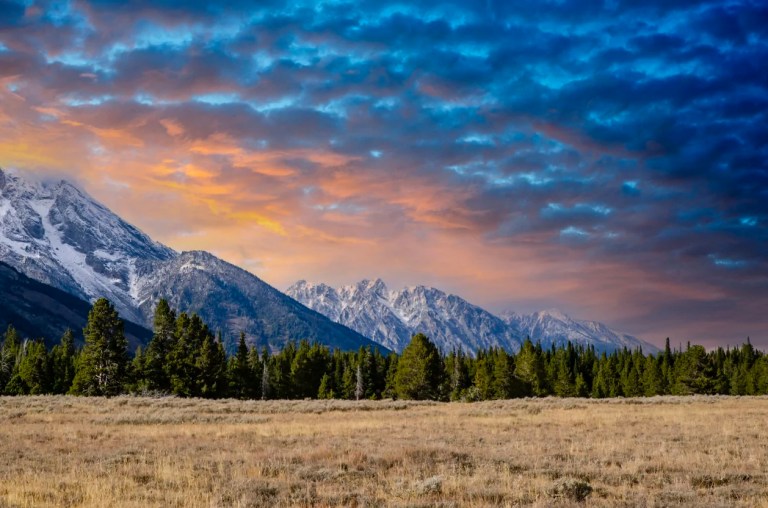 Sunset over the majestic peaks of the Teton Range of Grand Teton National Park Wyoming.