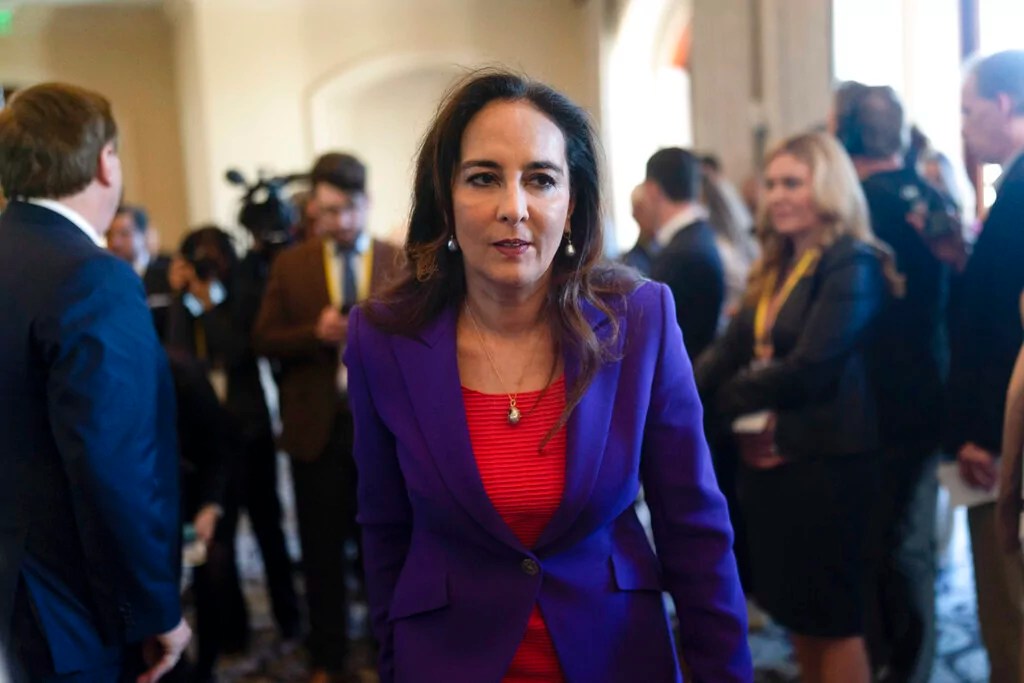Harmeet Dhillon walks through a hallway after talking to reporters at the Republican National Committee winter meeting in Dana Point, Calif., Friday, Jan. 27, 2023. (AP Photo/Jae C. Hong)