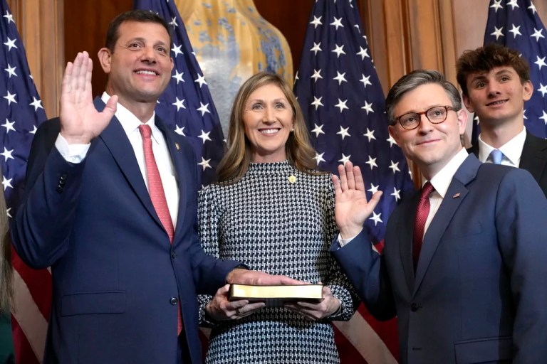 House Speaker Mike Johnson, R-La., second right, poses during a ceremonial swearing-in with Rep. David Valadao