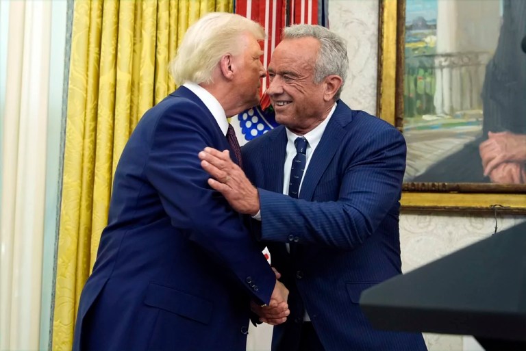 President Donald Trump congratulates Robert F. Kennedy Jr., after he was sworn in as Health and Human Services Secretary in the Oval Office at the White House, Thursday, Feb. 13, 2025, in Washington.