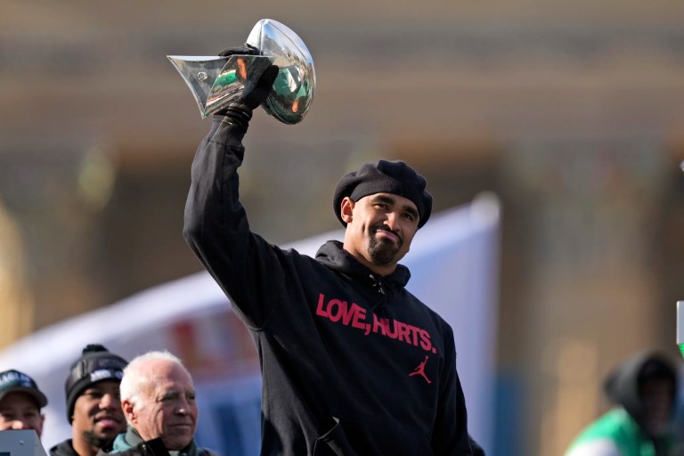 Philadelphia Eagles quarterback Jalen Hurts holds up the Lombardi trophy as he speaks during the team's NFL football Super Bowl 59 parade and celebration, Friday, Feb. 14, 2025, in Philadelphia.