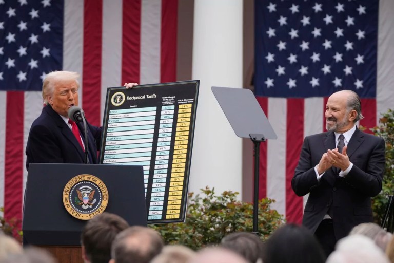 President Donald Trump speaks during an event to announce new tariffs in the Rose Garden at the White House, Wednesday, April 2, 2025, in Washington, as Commerce Secretary Howard Lutnick listens.