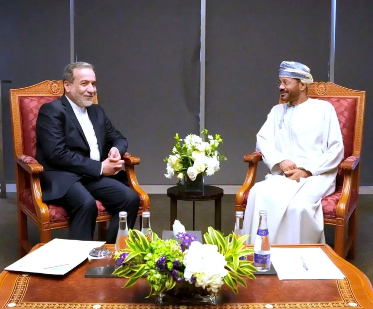 In this photo released by the Iranian Foreign Ministry, Iranian Foreign Minister Abbas Araghchi, left, meets Omani counterpart Sayyid Badr Bin Hamad Al Busaidi prior to negotiations with U.S. Mideast envoy Steve Witkoff in Muscat, Oman, Saturday, April 12, 2025.