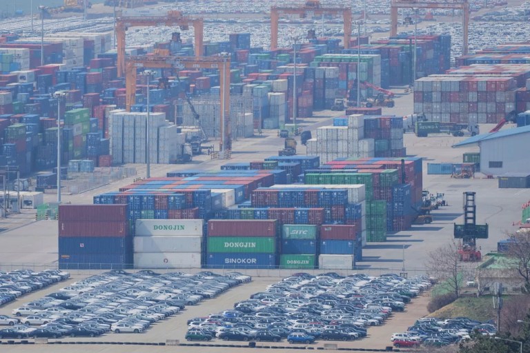 Vehicles, cranes and shipping containers are seen at a port in Pyeongtaek, South Korea, Tuesday, April 15, 2025.