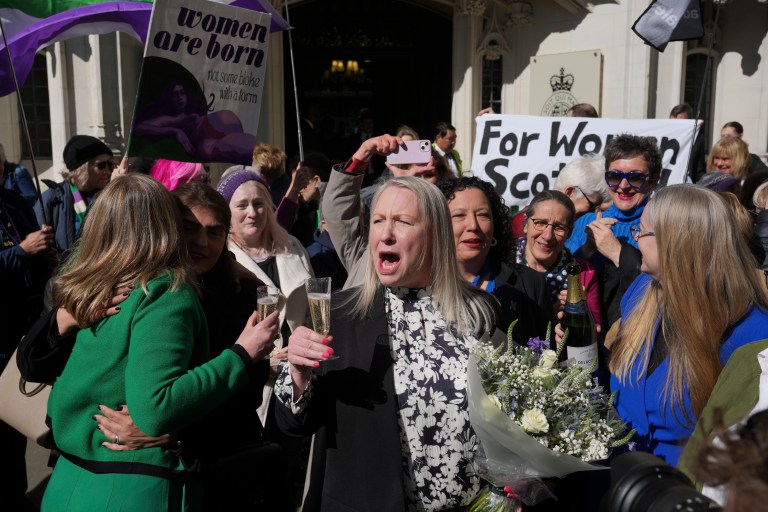 Marion Calder, center, and Susan Smith, left, of For Women Scotland, celebrate outside after the U.K. Supreme Court ruled that a woman is someone born biologically female in London, Wednesday, April 16, 2025.