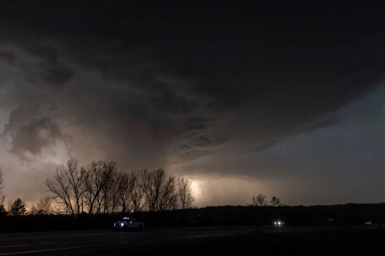 Clouds darken the sky as a storm that later produced a tornado is seen west of Highway 75 north of Omaha, Neb.