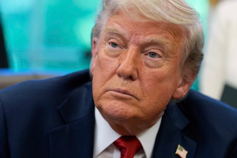 President Donald Trump speaks with reporters after signing executive orders in the Oval Office of the White House, Wednesday, April 23, 2025, in Washington.