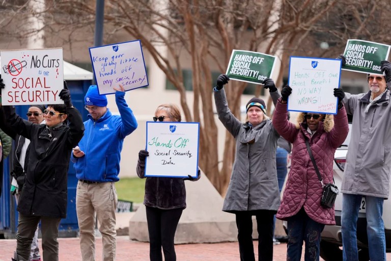 Demonstrators gather outside the Edward A. Garmatz U.S. District Courthouse in Baltimore, on Friday, March 14, 2025, before a hearing regarding the Department of Government Efficiency's access to Social Security data.